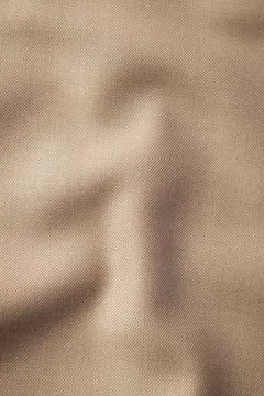 Light brown fabric background texture. Stock Photos