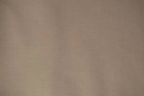 Light brown fabric background texture. Stock Photos