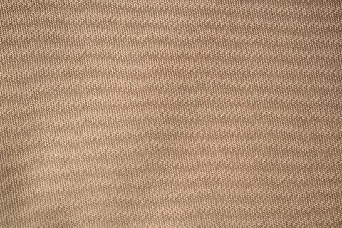 Light brown fabric background texture. Stock Photos