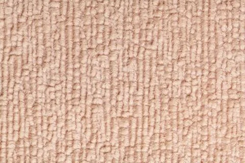 Light brown fluffy background of soft, fleecy cloth. Texture of textile close Stock Photos