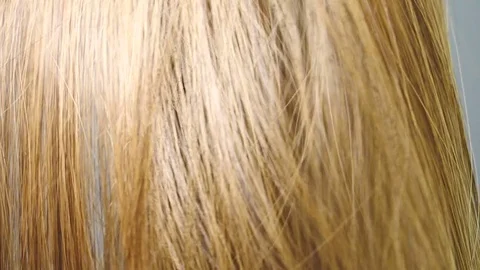 Light brown hair curls in slow motion Stock Footage