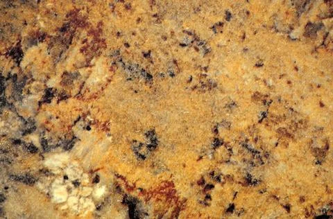 Light brown headset, a flat surface of natural stone with dark and light blot Stock Photos