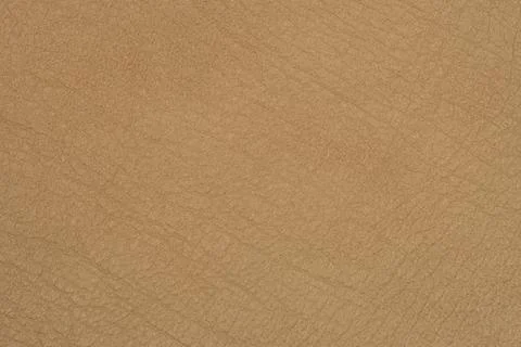 Light brown leather texture surface. Stock Photos