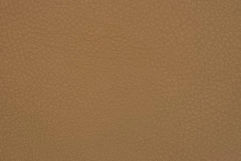 Light brown leather texture surface. Close-up of natural grain cow leather Li 스톡 사진