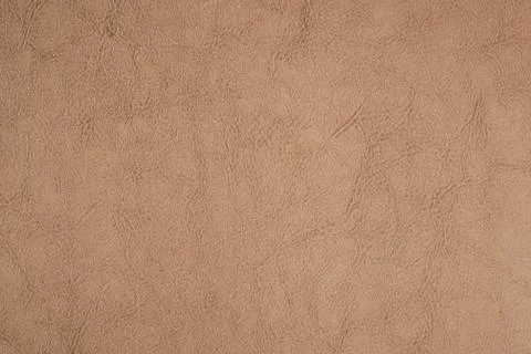 Light brown leather texture surface. Close-up of natural grain cow leather Li Stock Photos