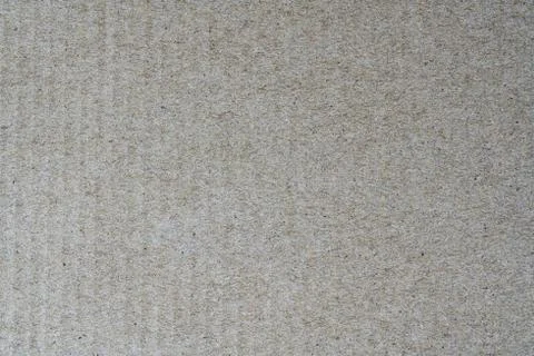 Light brown texture from sheet of recycled cardboard. Close up detail view Stock Photos