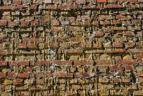 Light brown textured brick wall is good for background Stock Photos