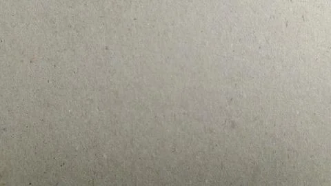 Light brown textured paper surface with subtle flecks creates an organic appe Stock Photos