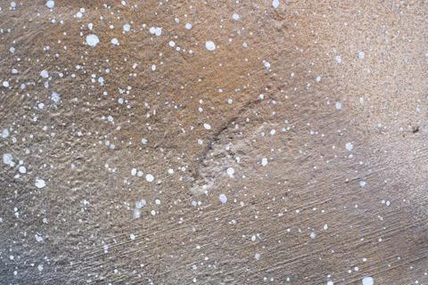 Light brown wall texture with white dots and spots Stock Photos