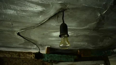 Light bulb in an abandoned house Stock Footage 135416370