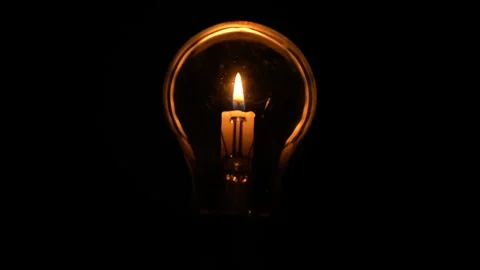 Light Bulb and Candle Flame. Candle in Light Bulb in Black Background Stock-Footage 320191710
