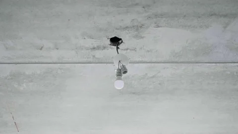 Light bulb and unrepaired ceiling. Beginning and planning Home Renovation. Video stock 148167845
