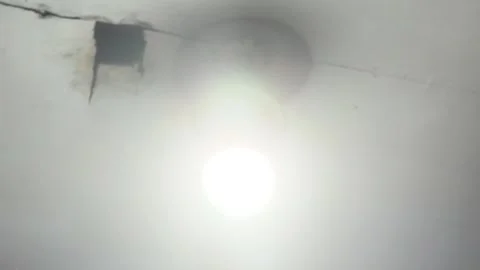 A light bulb is attached to the ceiling of the room 스톡 동영상 341746319