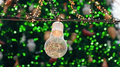 Light bulb beside the Christmas tree Stock Footage 226971232