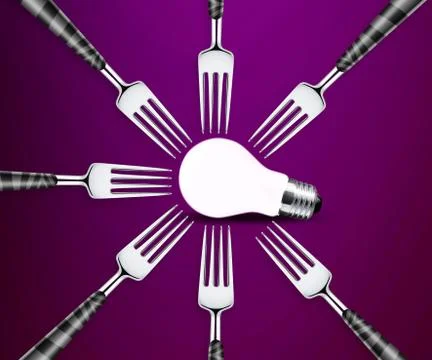 Light bulb between forks Stock Photos