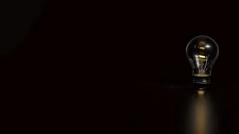 The Light bulb on Black background  for creative concept 3d Rendering. Stock Illustration