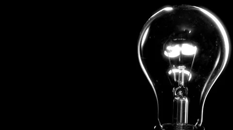 Light bulb on black background. Video stock 54937382