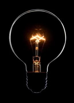 Light bulb on black background Stock Photos