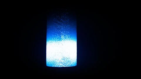 Light bulb in black background. Fotos de archivo