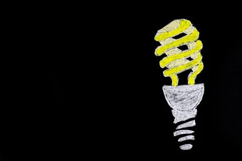 Light bulb on black background Stock Photos