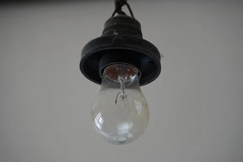 Light bulb on black background Stock Photos