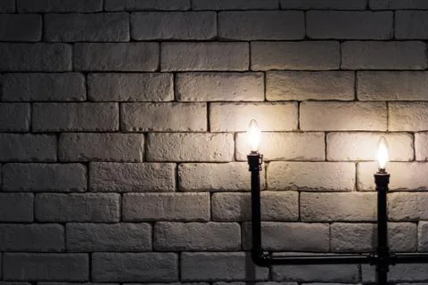 Light bulb with black pipe Stock Photos