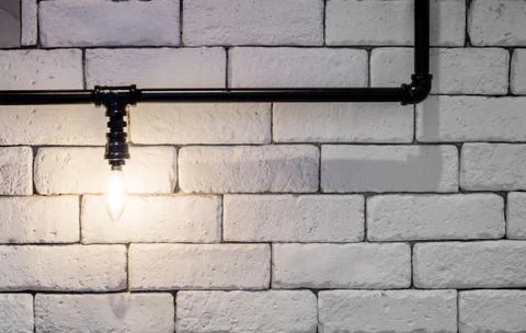 Light bulb with black pipe Stock Photos
