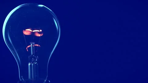 Light bulb on blue background. light turns on and off Video stock 54937227
