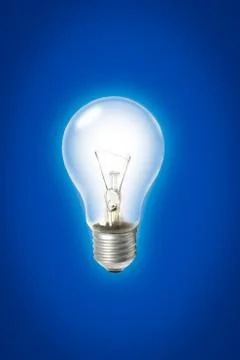 Light bulb on blue background Stock Photos