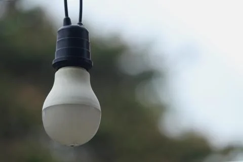 Light bulb on blur background Stock Photos