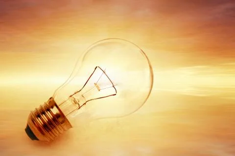 Light bulb on bright background Stock Photos