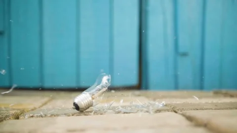 Light bulb is broken on the ground in slow motion 库存影片 112689718