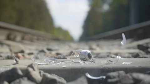 Light bulb is broken on the railway in slow motion Stock Footage 112689666
