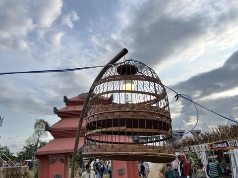 Light bulb in a cage in the park. Stock Photos
