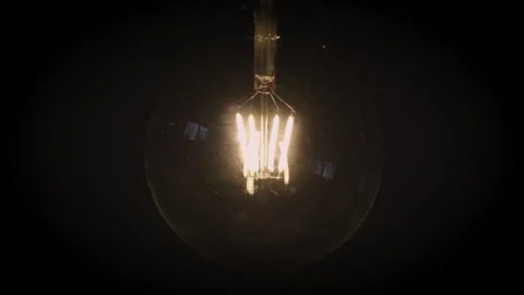 Light bulb in close-up on black background Stock Footage 291954133