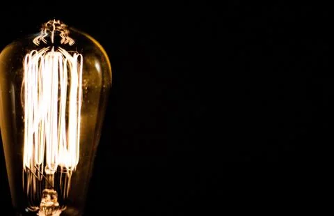 Light bulb closeup with black background isolated Foto stock
