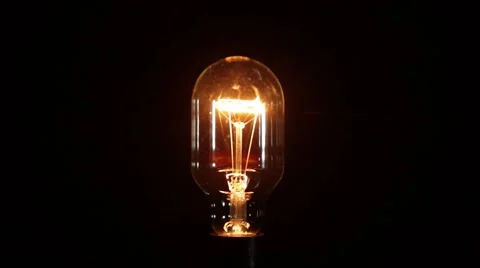 Light bulb closeup with moderate bright turns on/off fast and slow Video stock 51606699