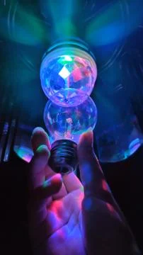 Light bulb with colors Stock Photos