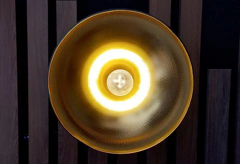 Light bulb with a copper cap in the shape of a circle. Stock Photos