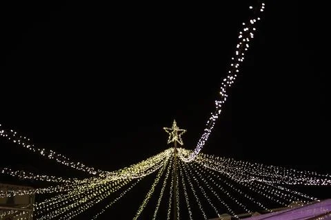 Light bulb decor, the string of lights on a dark background Stock Photos