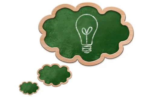 Light bulb drawn on a thought bubble shaped blackboard Stock Illustration