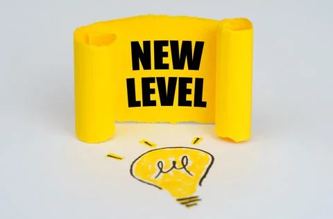 A light bulb is drawn on a white background, next to it is a yellow plate wit Stock Photos