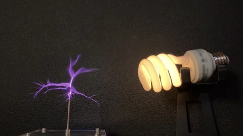 Light bulb electrified with tesla coil. 4K 60fps Stock Footage 272200432