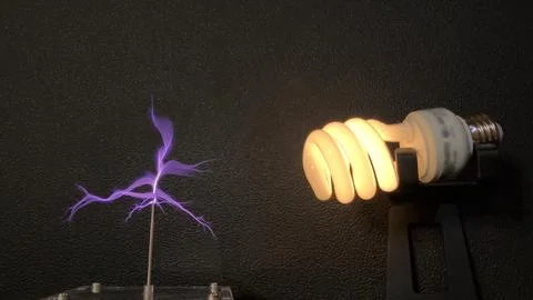 Light bulb electrified with tesla coil. Stock Photos