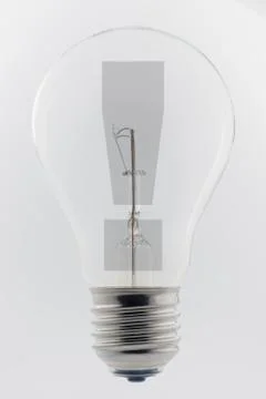 Light bulb with a exclamation mark. Stock Photos