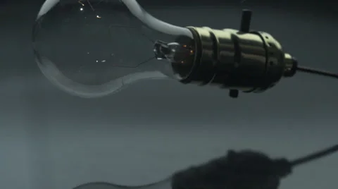 Light bulb falling on floor, Slow Motion Stock Footage 25388224