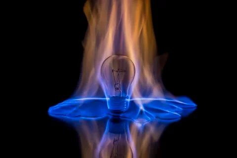Light bulb on fire Stock Photos