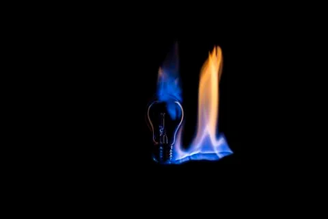 Light bulb on fire Stock Photos