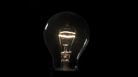 Light bulb flickering . 4k Black background Stock Footage 89648759