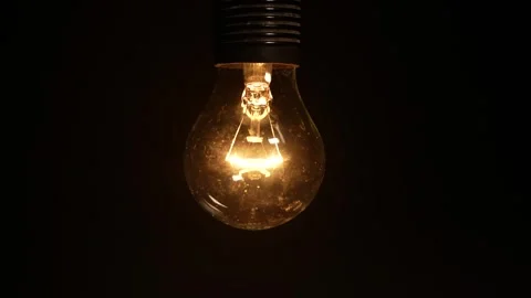 Light bulb flickering. Unstable voltage. Power outages Stock-Footage 320194387